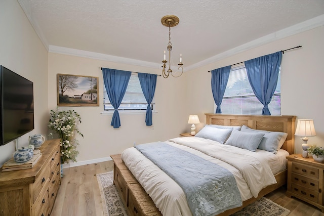 5123 Adams Rd, Delray Beach, FL 33484 - bedroom with light wood-type flooring, a textured ceiling, baseboards, and ornamental molding