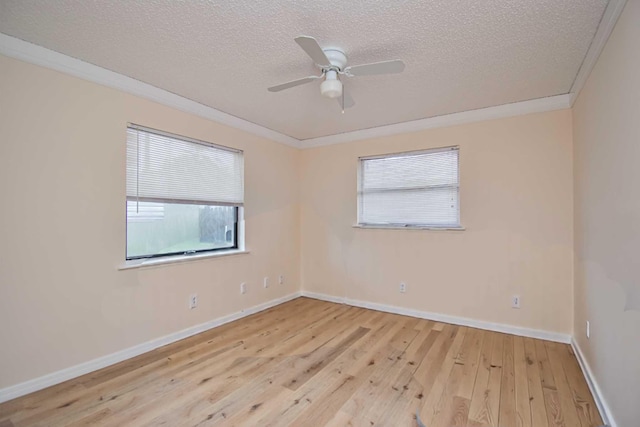 5123 Adams Rd, Delray Beach, FL 33484 - unfurnished room featuring plenty of natural light, a textured ceiling, light wood-style floors, baseboards, and ceiling fan
