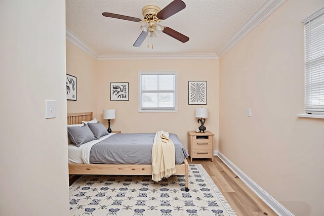 5123 Adams Rd, Delray Beach, FL 33484 - bedroom featuring crown molding, light wood-style floors, baseboards, ceiling fan, and a textured ceiling