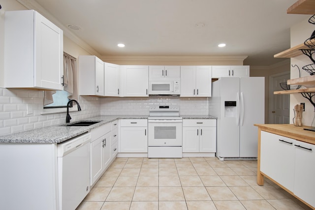5123 Adams Rd, Delray Beach, FL 33484 - kitchen with white appliances, a sink, open shelves, backsplash, and white cabinetry
