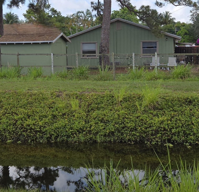 5123 Adams Rd, Delray Beach, FL 33484 - rear view of house featuring board and batten siding
