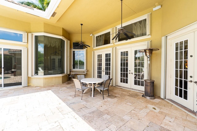 21675 Fall River Dr, Boca Raton, FL 33428 - view of patio / terrace featuring french doors, a ceiling fan, and outdoor dining space