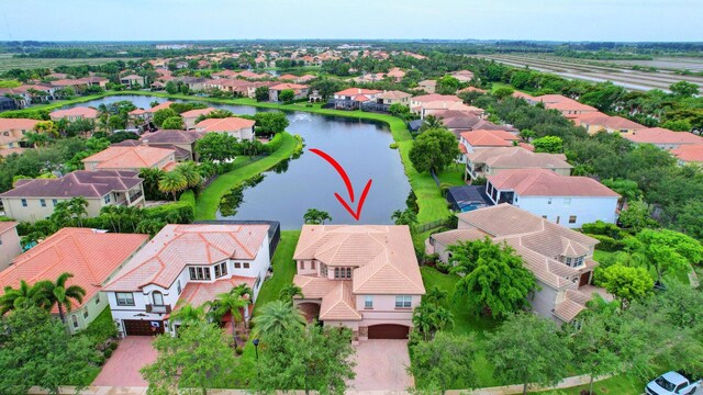 aerial view of residential area with a nearby body of water
