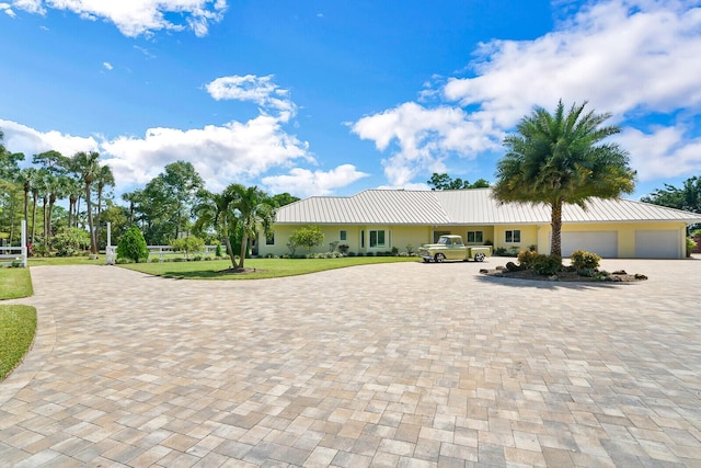 6624 Dillman Rd, West Palm Beach, FL 33413 - view of front of property with driveway, an attached garage, a front lawn, and stucco siding