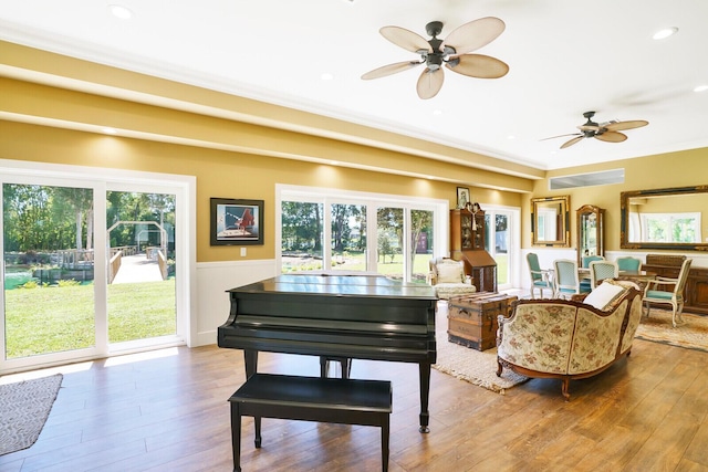 6624 Dillman Rd, West Palm Beach, FL 33413 - living room with ceiling fan, wood finished floors, a wainscoted wall, crown molding, and recessed lighting