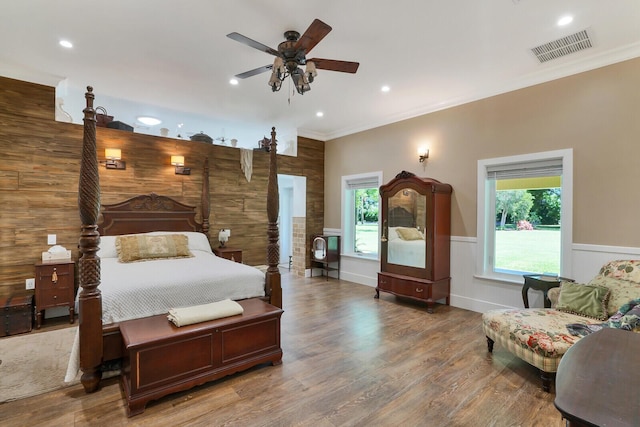 6624 Dillman Rd, West Palm Beach, FL 33413 - bedroom with multiple windows, crown molding, wood finished floors, a wainscoted wall, and recessed lighting