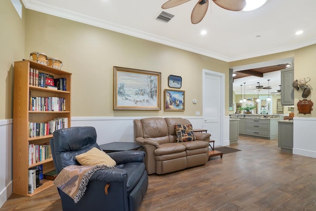 6624 Dillman Rd, West Palm Beach, FL 33413 - living room featuring ceiling fan, ornamental molding, wainscoting, wood finished floors, and recessed lighting