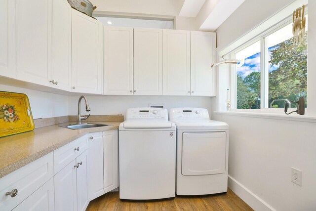 6624 Dillman Rd, West Palm Beach, FL 33413 - laundry area featuring cabinet space, washer and dryer, wood finished floors, and baseboards