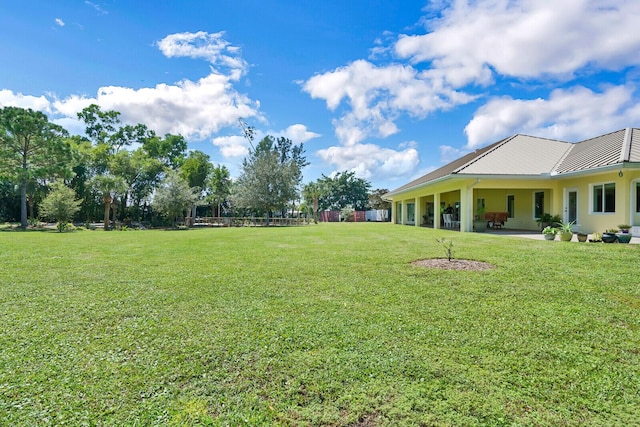 6624 Dillman Rd, West Palm Beach, FL 33413 - view of green lawn with a patio area