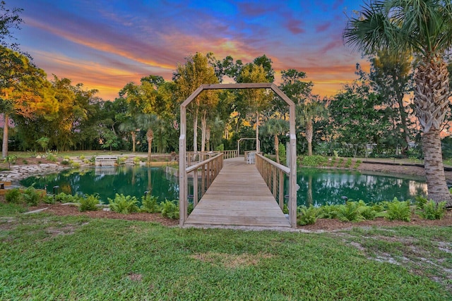 6624 Dillman Rd, West Palm Beach, FL 33413 - dock area with a water view and a yard