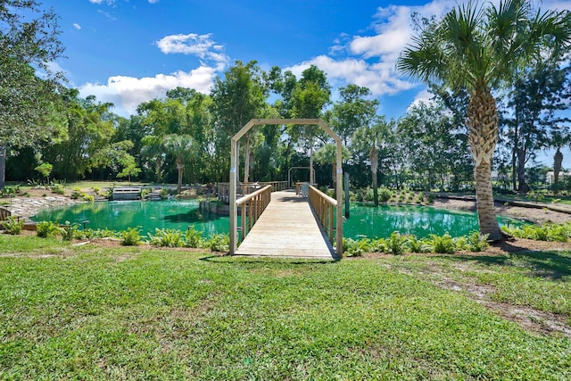 6624 Dillman Rd, West Palm Beach, FL 33413 - dock area featuring a yard