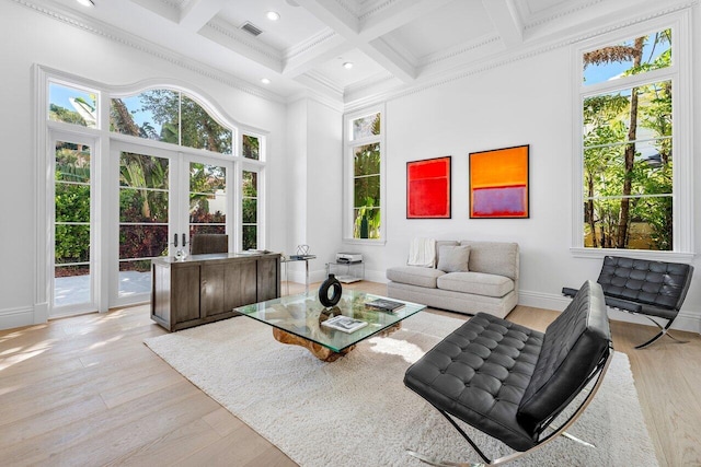 155 SE Spanish Trl, Boca Raton, FL 33432 - living area with coffered ceiling, a towering ceiling, crown molding, beam ceiling, and wood finished floors