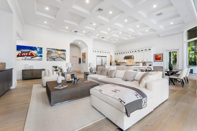 155 SE Spanish Trl, Boca Raton, FL 33432 - living room with a towering ceiling, coffered ceiling, recessed lighting, beamed ceiling, and light wood-type flooring
