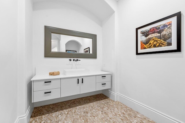 155 SE Spanish Trl, Boca Raton, FL 33432 - bathroom with vanity and baseboards