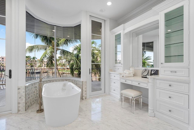 155 SE Spanish Trl, Boca Raton, FL 33432 - full bath featuring a freestanding bath, marble tiled flooring, and a water view