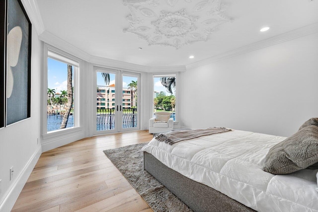 155 SE Spanish Trl, Boca Raton, FL 33432 - bedroom featuring ornamental molding, access to exterior, multiple windows, french doors, and recessed lighting