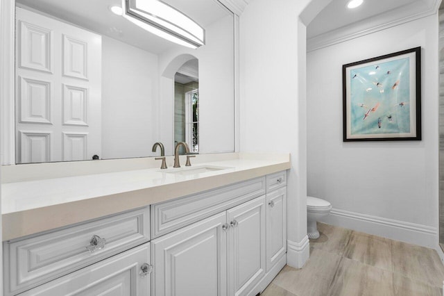 155 SE Spanish Trl, Boca Raton, FL 33432 - bathroom with vanity, toilet, baseboards, and recessed lighting