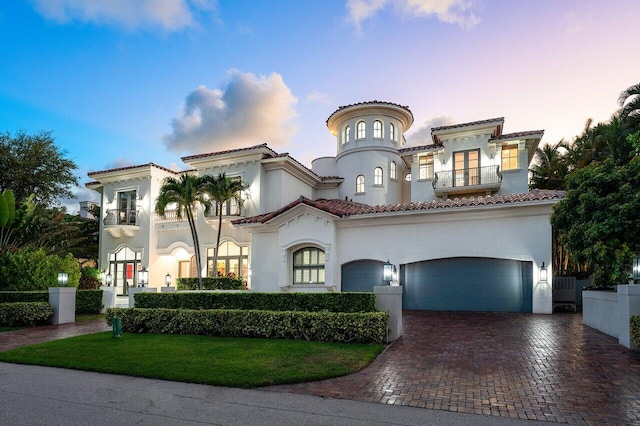 155 SE Spanish Trl, Boca Raton, FL 33432 - mediterranean / spanish home with a balcony, decorative driveway, stucco siding, a lawn, and a tile roof