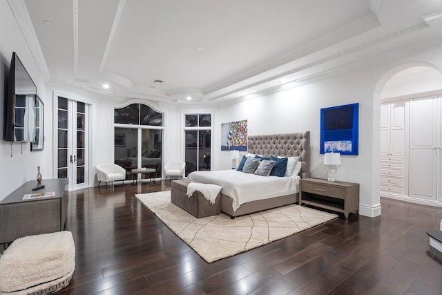 155 SE Spanish Trl, Boca Raton, FL 33432 - bedroom with ornamental molding, wood-type flooring, arched walkways, a raised ceiling, and french doors