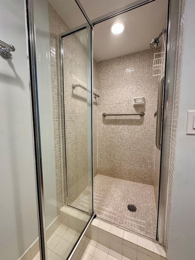 full bathroom with a shower stall, tile patterned floors, and recessed lighting