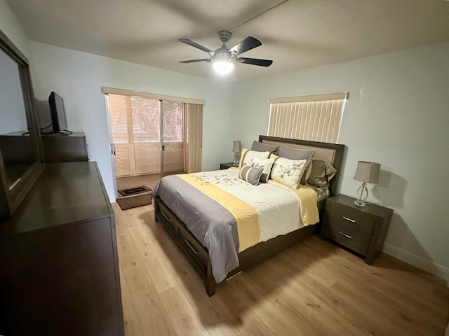 bedroom featuring light wood-style flooring, baseboards, and ceiling fan