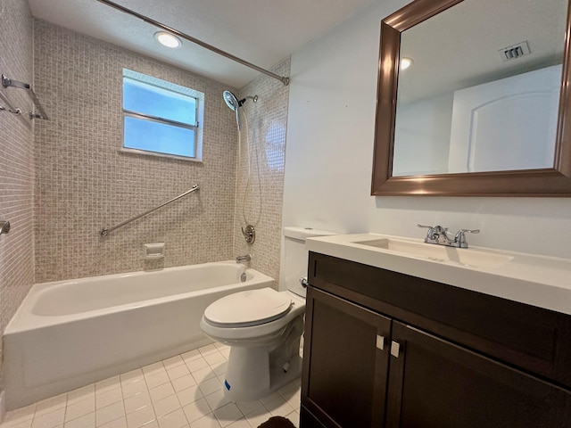 bathroom featuring toilet, tile patterned floors, washtub / shower combination, and vanity