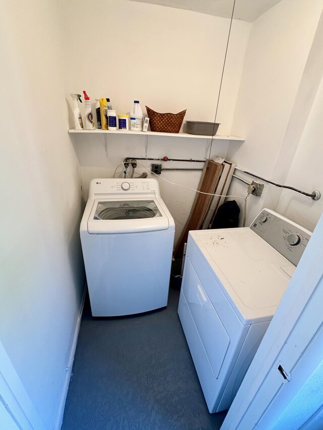 laundry area with separate washer and dryer and carpet flooring