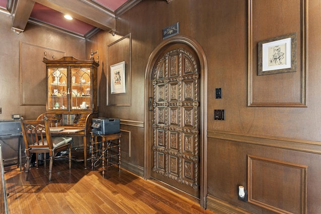 11 Wendy Ln, Stuart, FL 34994 - wine area featuring wood finished floors, beamed ceiling, coffered ceiling, ornamental molding, and a decorative wall