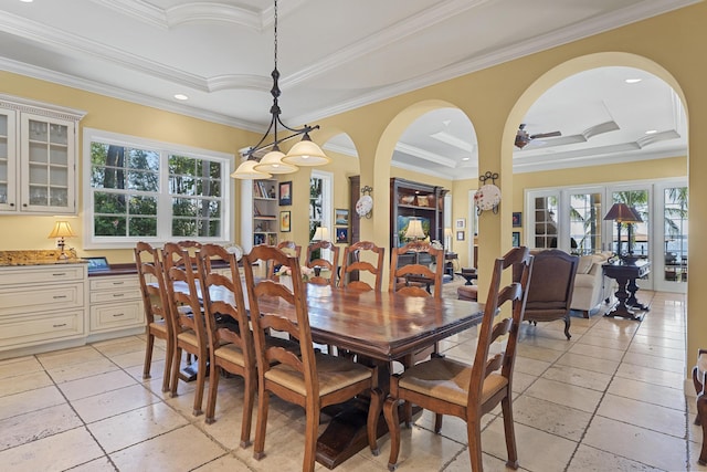 11 Wendy Ln, Stuart, FL 34994 - dining space with a tray ceiling, healthy amount of natural light, crown molding, arched walkways, and recessed lighting
