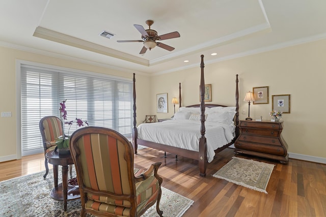 11 Wendy Ln, Stuart, FL 34994 - bedroom featuring a raised ceiling, wood finished floors, crown molding, and baseboards