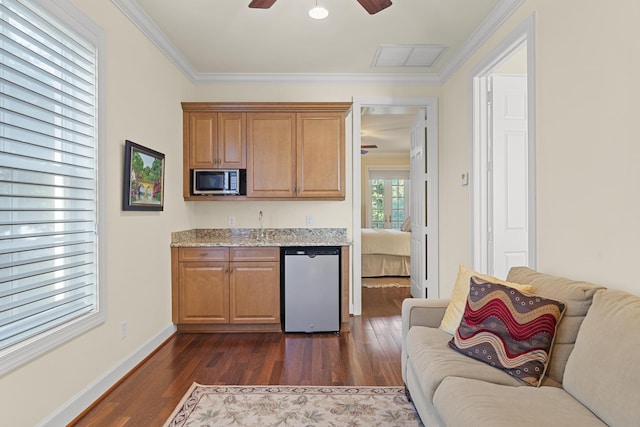 11 Wendy Ln, Stuart, FL 34994 - kitchen featuring stainless steel appliances, dark wood-type flooring, a ceiling fan, open floor plan, and crown molding