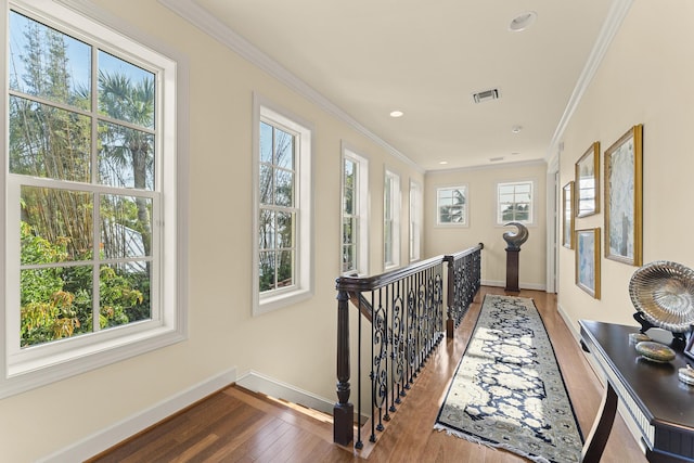 11 Wendy Ln, Stuart, FL 34994 - hall with an upstairs landing, baseboards, wood finished floors, crown molding, and recessed lighting