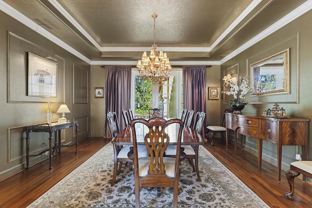11 Wendy Ln, Stuart, FL 34994 - dining area with a chandelier, a raised ceiling, plenty of natural light, hardwood / wood-style floors, and crown molding