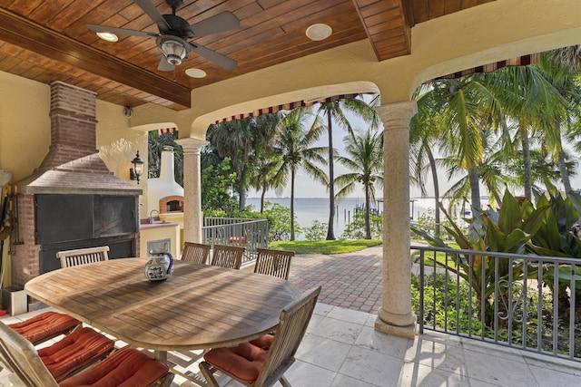 11 Wendy Ln, Stuart, FL 34994 - view of patio featuring a water view, ceiling fan, a sink, and outdoor dining area