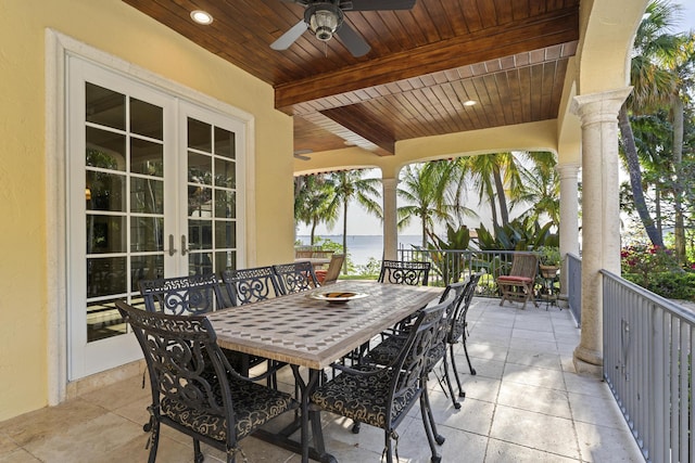 11 Wendy Ln, Stuart, FL 34994 - view of patio / terrace with french doors, outdoor dining area, a water view, and ceiling fan