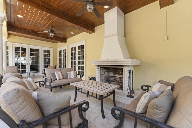 11 Wendy Ln, Stuart, FL 34994 - view of patio featuring a ceiling fan, an outdoor living space with a fireplace, and french doors