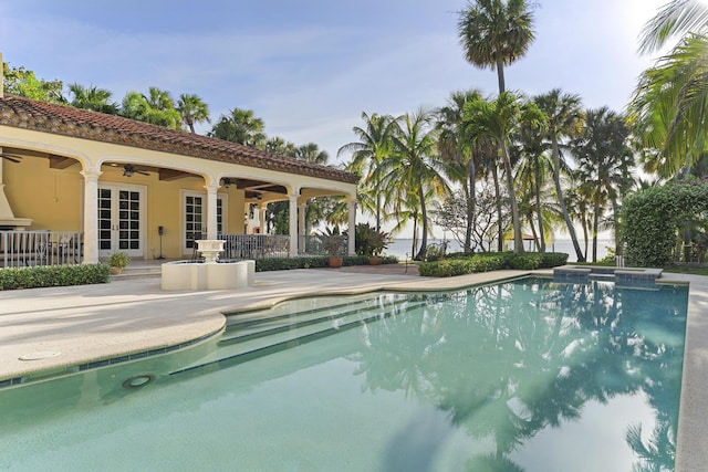 11 Wendy Ln, Stuart, FL 34994 - view of pool with ceiling fan, french doors, a patio, and a pool with connected hot tub