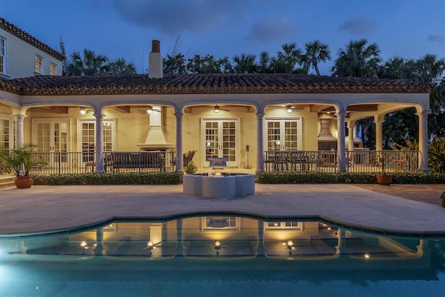 11 Wendy Ln, Stuart, FL 34994 - swimming pool featuring french doors and a patio