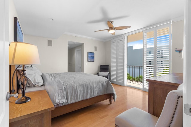 101 SE 20th Ave Unit 501, Deerfield Beach, FL 33441 - bedroom with access to outside, wood finished floors, a ceiling fan, and ornamental molding