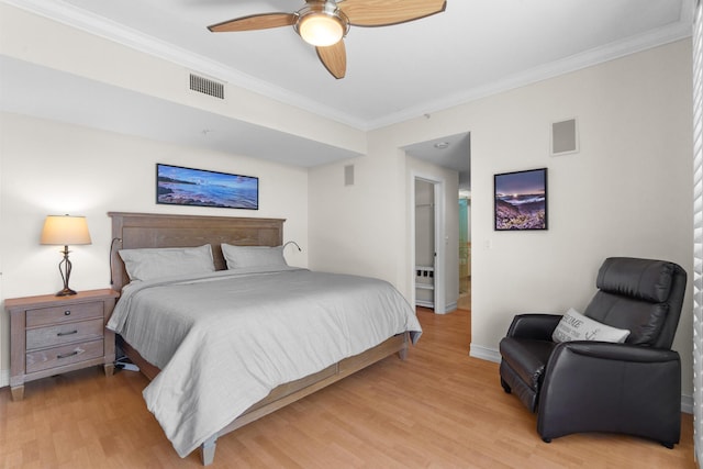 101 SE 20th Ave Unit 501, Deerfield Beach, FL 33441 - bedroom with crown molding, wood finished floors, baseboards, and a ceiling fan