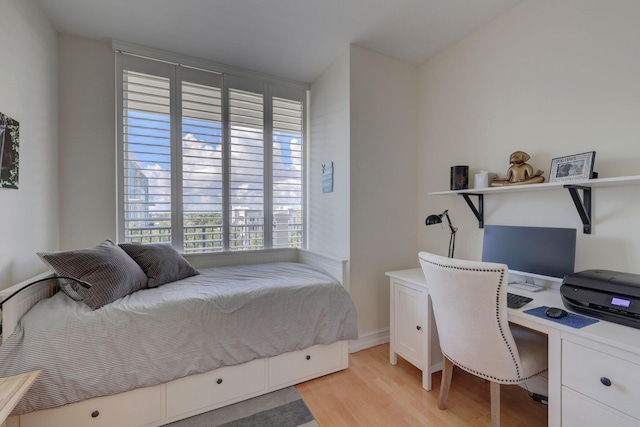 101 SE 20th Ave Unit 501, Deerfield Beach, FL 33441 - bedroom with light wood-style floors and a desk