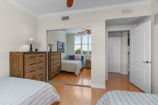 101 SE 20th Ave Unit 501, Deerfield Beach, FL 33441 - bedroom featuring light wood finished floors, crown molding, ceiling fan, and baseboards