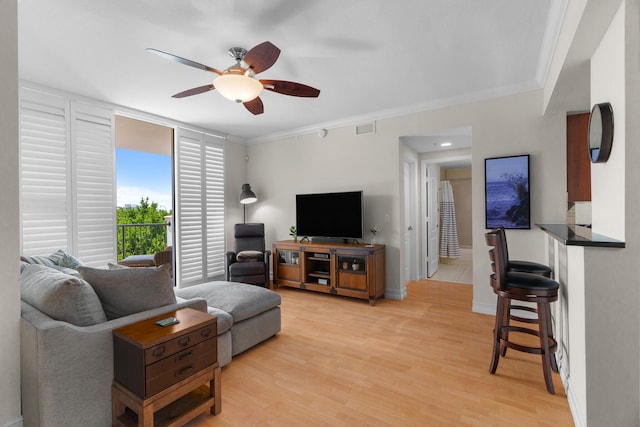 101 SE 20th Ave Unit 501, Deerfield Beach, FL 33441 - living room with a ceiling fan, light wood-style floors, ornamental molding, and baseboards