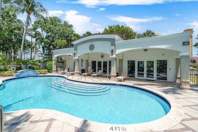 101 SE 20th Ave Unit 501, Deerfield Beach, FL 33441 - view of swimming pool with french doors, a patio, and fence