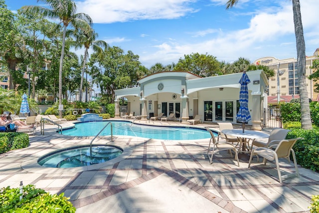 101 SE 20th Ave Unit 501, Deerfield Beach, FL 33441 - community pool featuring french doors, a hot tub, a patio area, and fence
