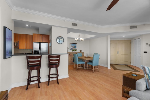 101 SE 20th Ave Unit 501, Deerfield Beach, FL 33441 - living room with light wood-style flooring, ornamental molding, a chandelier, baseboards, and a ceiling fan