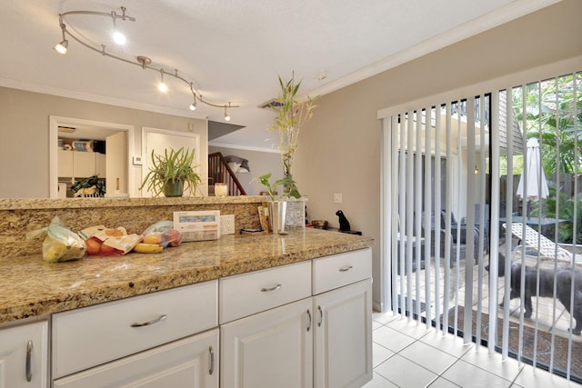 2950 SW 22nd Cir Unit 4C, Delray Beach, FL 33445 - kitchen with ornamental molding, white cabinets, and light tile patterned floors
