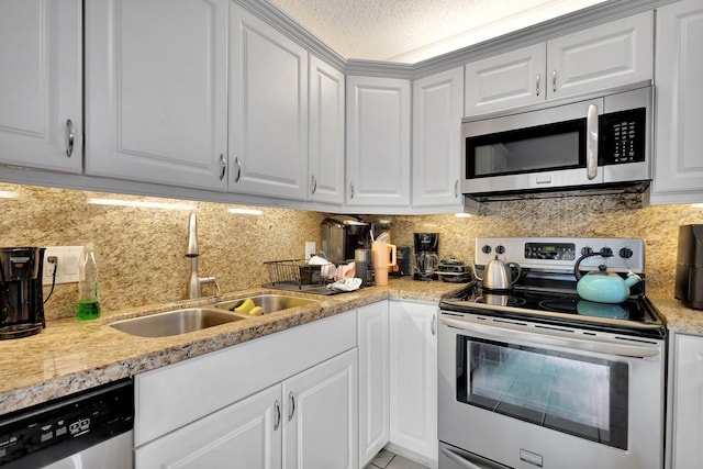 2950 SW 22nd Cir Unit 4C, Delray Beach, FL 33445 - kitchen featuring stainless steel appliances, a sink, light countertops, and decorative backsplash