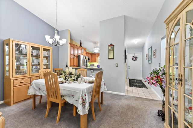 3001 SE Aster Ln Unit 908, Stuart, FL 34994 - dining space featuring carpet floors, a chandelier, baseboards, french doors, and tile patterned flooring