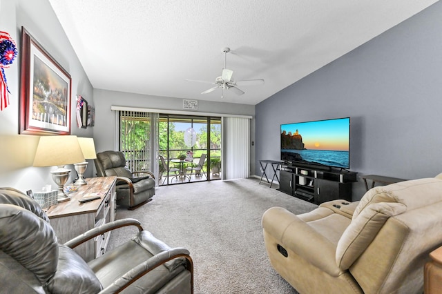 3001 SE Aster Ln Unit 908, Stuart, FL 34994 - carpeted living area with vaulted ceiling, a ceiling fan, and a textured ceiling